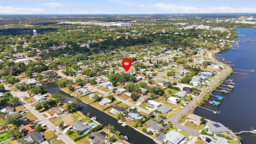 This aerial view shows a residential neighborhood with canals and a red location marker — 101 20TH STREET NE, BRADENTON, FL