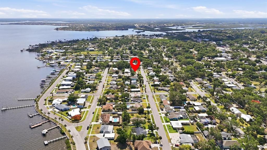 This is an aerial view of a residential neighborhood near a body of water — 101 20TH STREET NE, BRADENTON, FL
