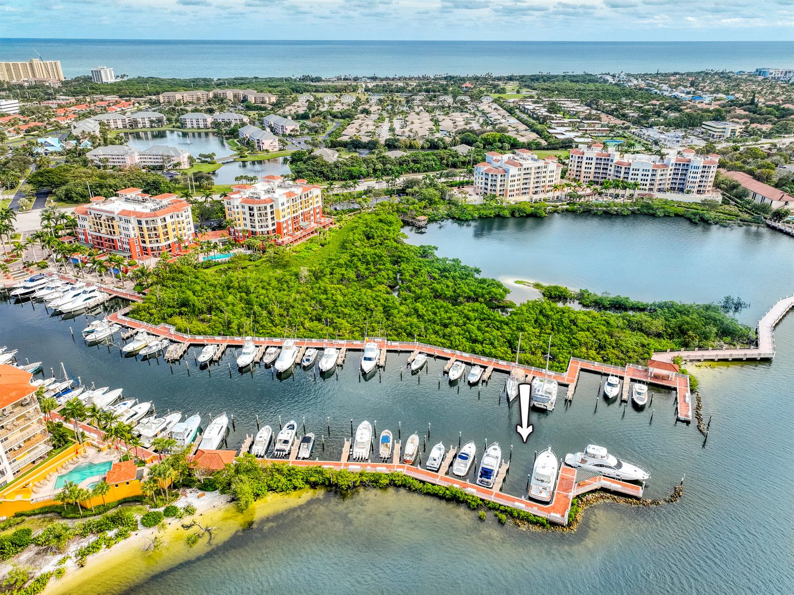 An aerial view shows a marina with numerous boats docked along wooden piers — 348 S Us Highway 1, Jupiter FL 33477, JUPITER, FL