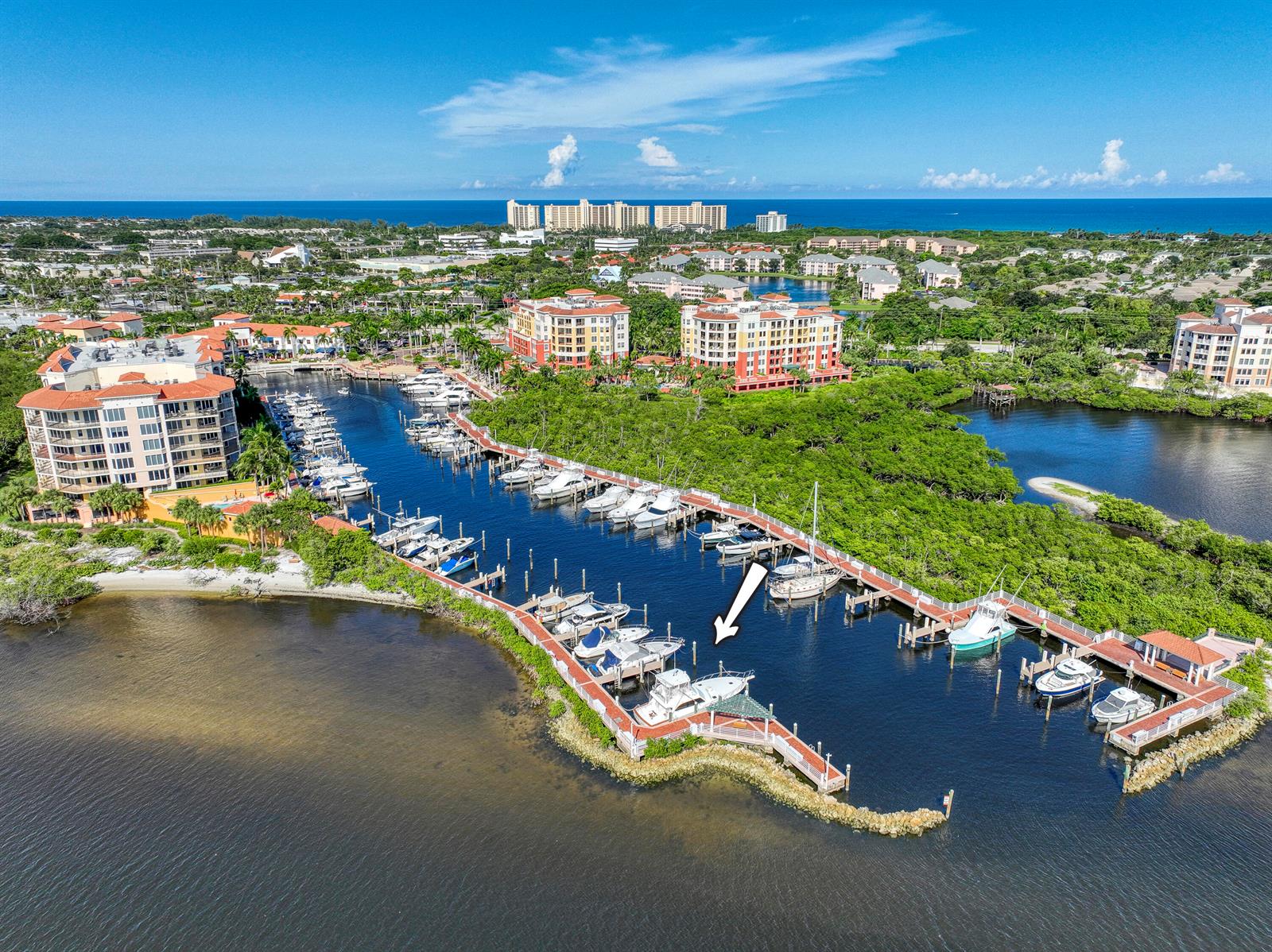 An aerial view shows a marina with multiple docked boats and surrounding residential buildings — 348 S Us Highway 1, Jupiter FL 33477, JUPITER, FL