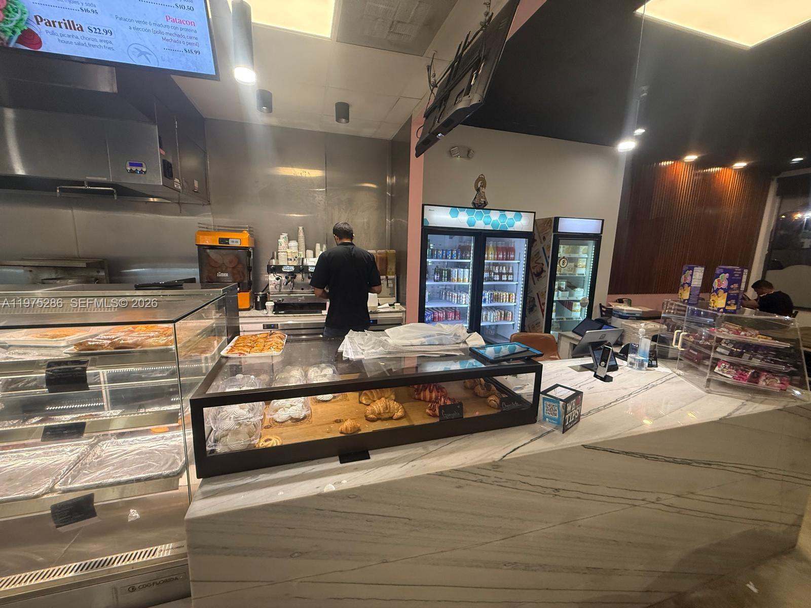 A commercial kitchen and service counter with a marble top and glass display cases — Confidential NW 67th Ave, Hialeah FL 33015, HIALEAH, FL