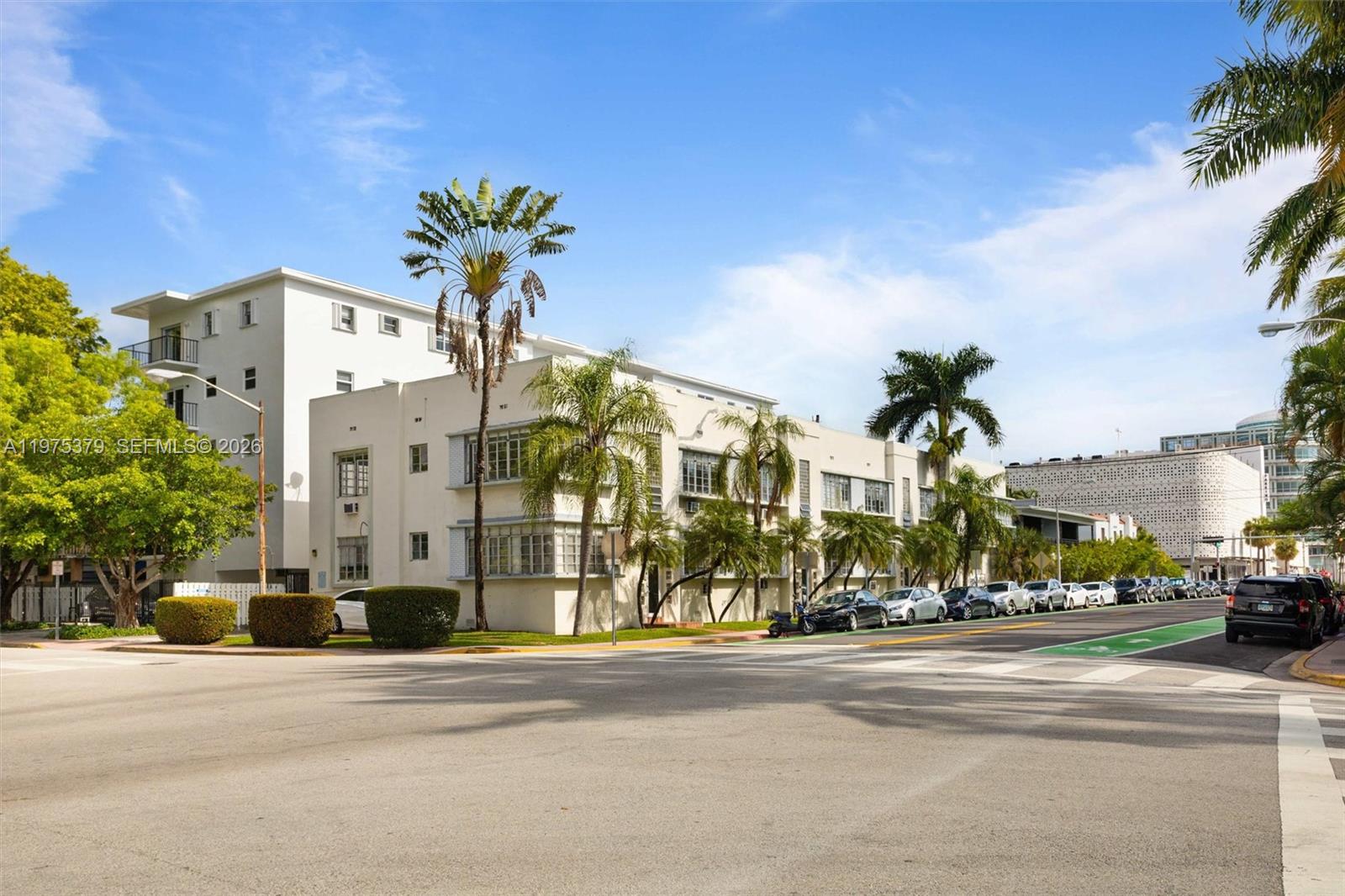 A multi-story white apartment building stands on a corner lot with palm trees — 531 16th St, Miami Beach FL 33139, MIAMI BEACH, FL