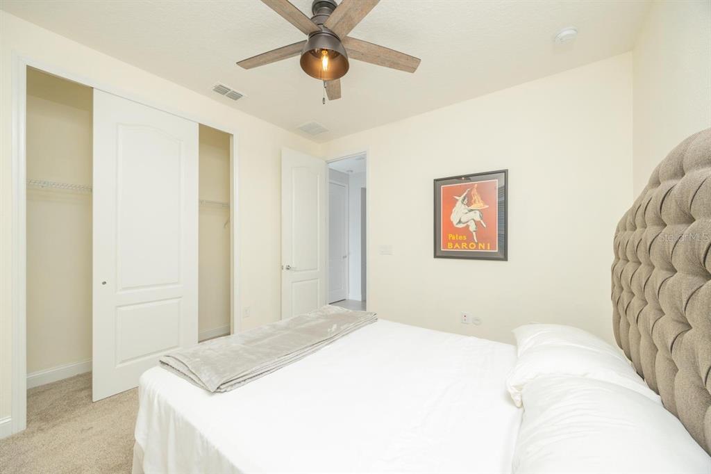 An entryway features a blue front door, light tile flooring, and a wooden console table — 213 OLETA WAY, ST AUGUSTINE, FL