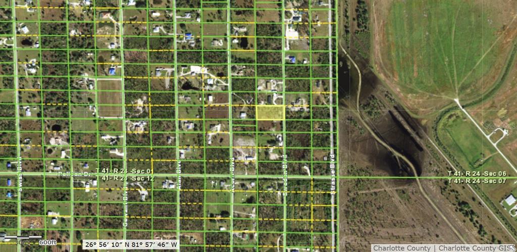 This is a satellite map showing a highlighted rectangular land parcel within a residential grid — 6453 SWEDEN BOULEVARD, PUNTA GORDA, FL
