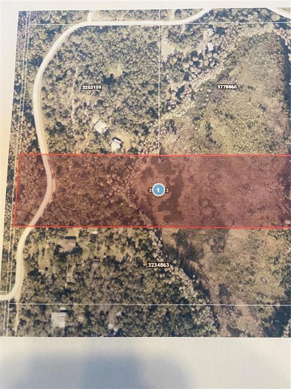 An aerial map view shows a rectangular parcel of land highlighted in red — 0 MILLSTREAM DRIVE, GROVELAND, FL