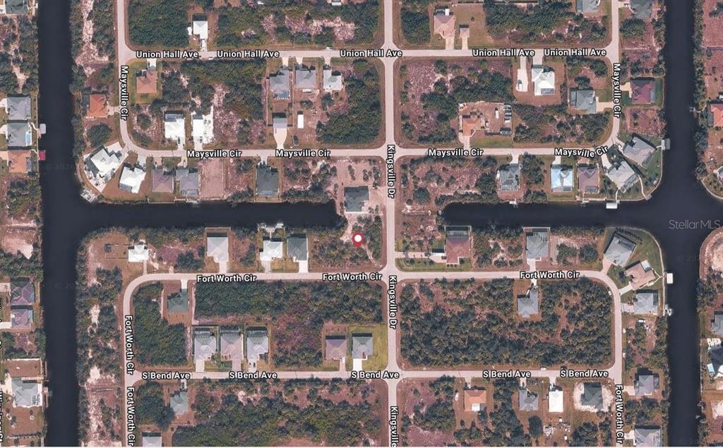 This is an aerial map view of a residential neighborhood with houses and canals — 10181 KINGSVILLE DRIVE, PORT CHARLOTTE, FL