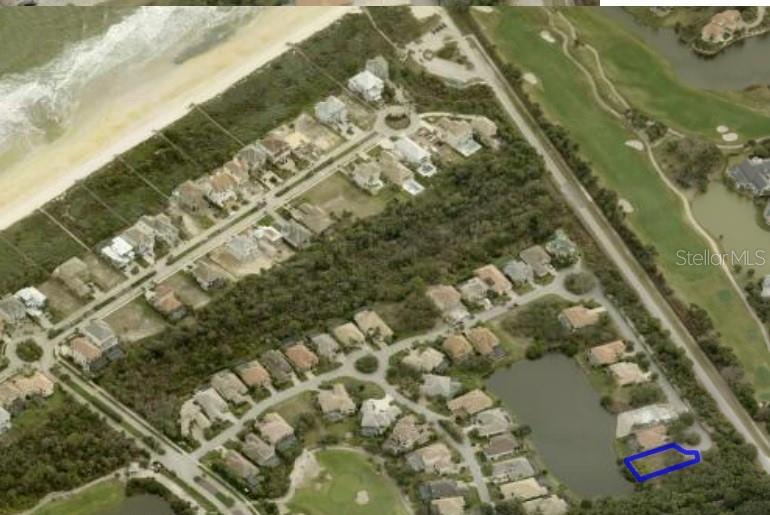 A vacant, grassy residential lot sits next to a house at the end of a cul-de-sac — 46 ATLANTIC PLACE, PALM COAST, FL