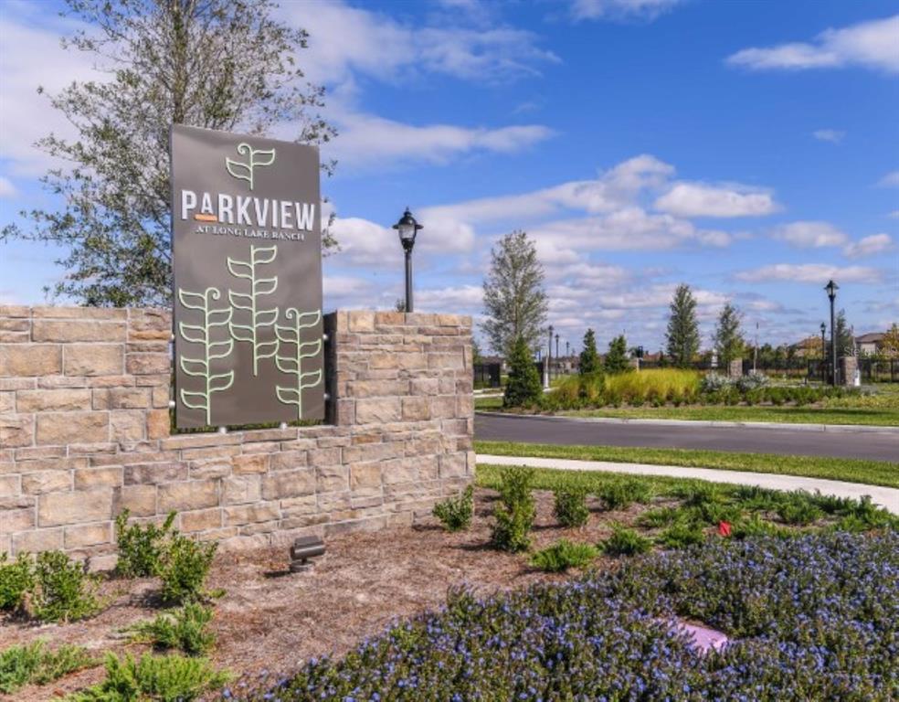A stone monument sign for Parkview at Long Lake Ranch stands near a landscaped entrance — 2525 ARBOR WIND DRIVE, LUTZ, FL