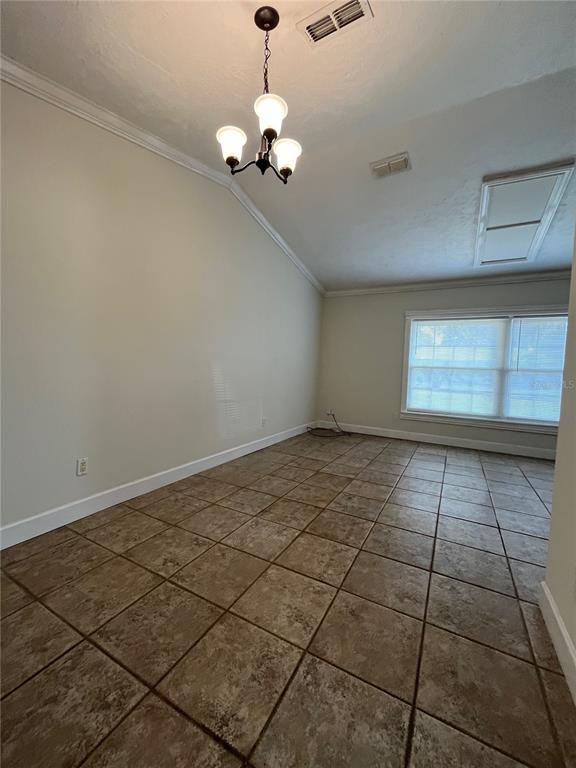 A room with vaulted ceilings, tile flooring, a chandelier, and a window with blinds — 3222 HAMMERSMITH ROAD, ORLANDO, FL