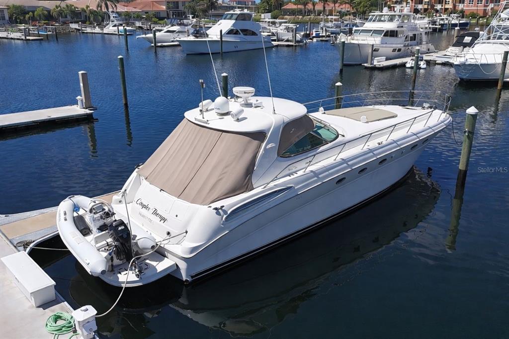 A white yacht named Couples Therapy is docked in a marina with other boats — 102 RIVIERA DUNES WAY UNIT S-55, PALMETTO, FL