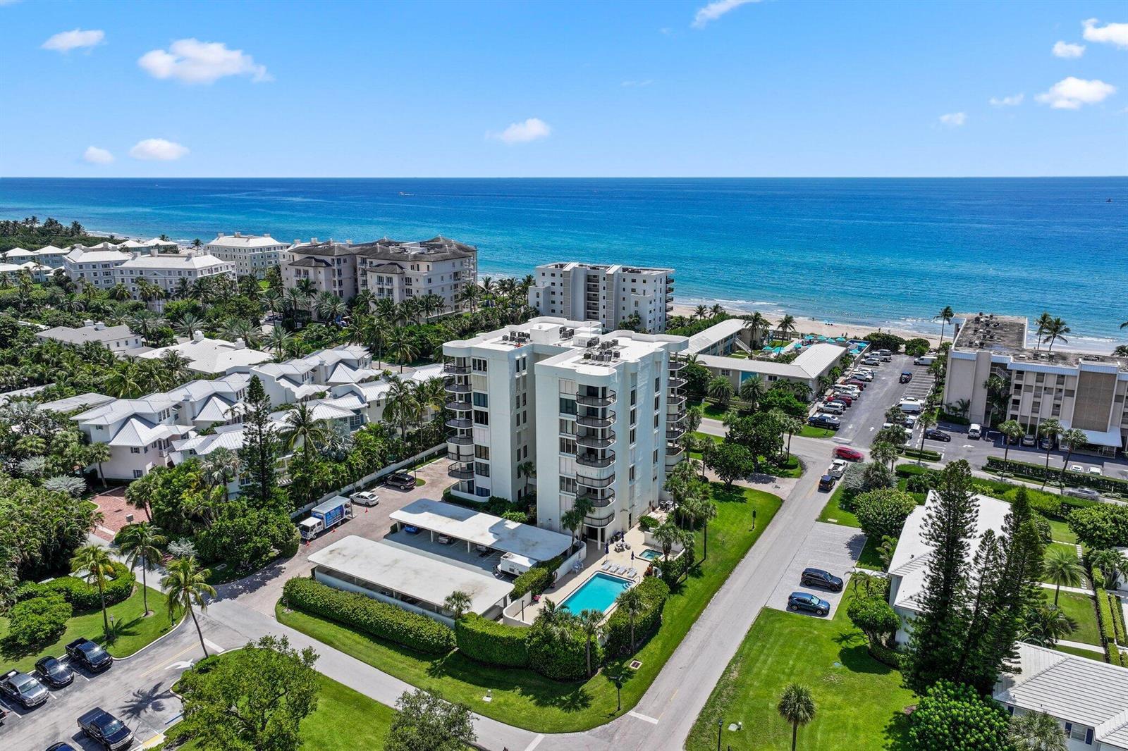 An aerial view shows a multi-story residential building with a swimming pool near the ocean — 3900 N Ocean Boulevard, Gulf Stream FL 33483, GULF STREAM, FL