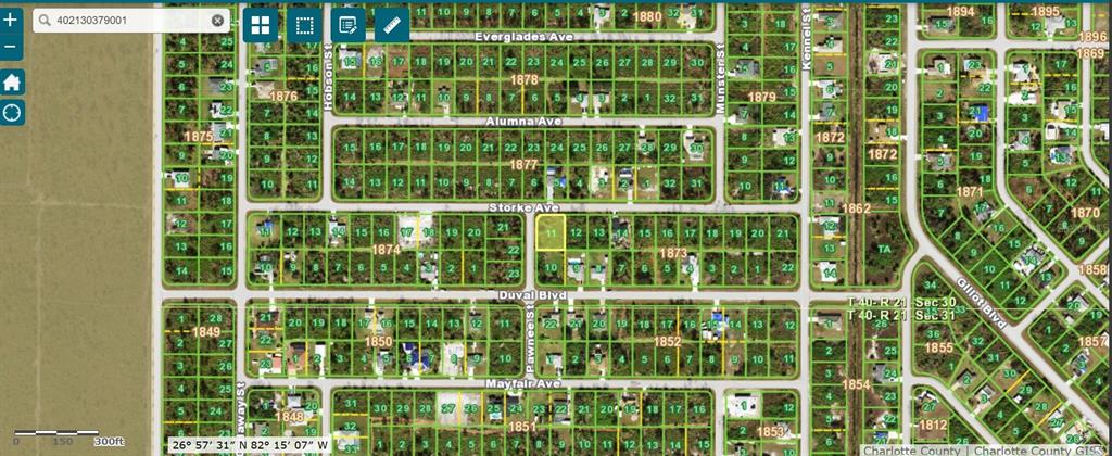 This is a satellite map view of a residential neighborhood with platted land parcels — 12143 STORKE AVENUE, PORT CHARLOTTE, FL