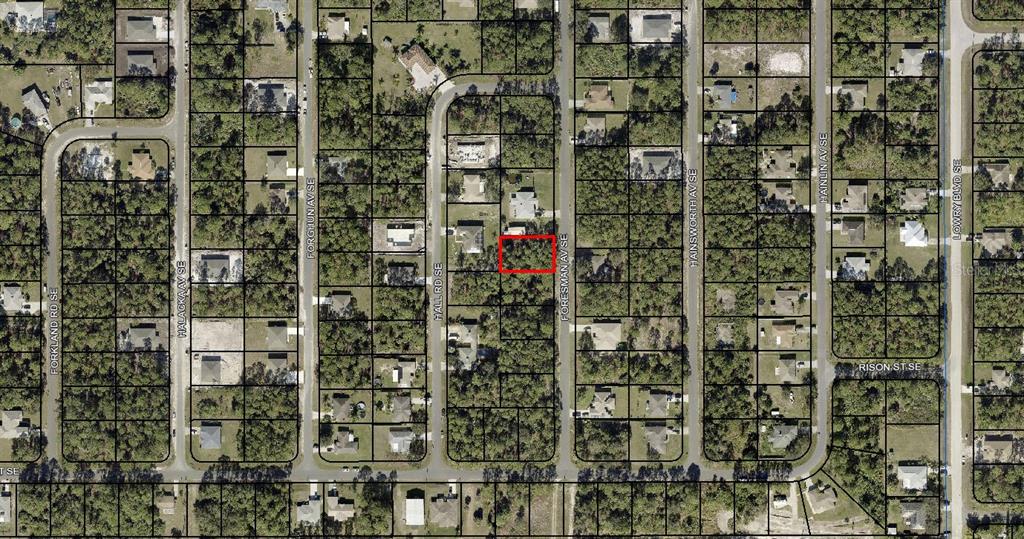 This is an aerial map showing a vacant, rectangular lot highlighted in red within a residential neighborhood — 3258 FORESMAN AVENUE SE, PALM BAY, FL