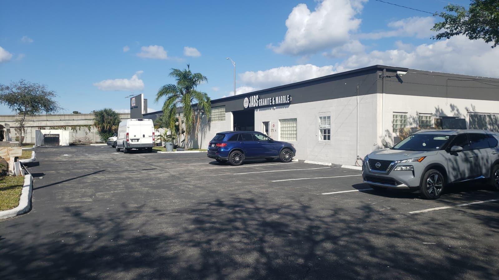A commercial building with a Jabs Granite & Marble sign and a parking lot out front — 1815 10th Avenue N # C, FL 33461, FL