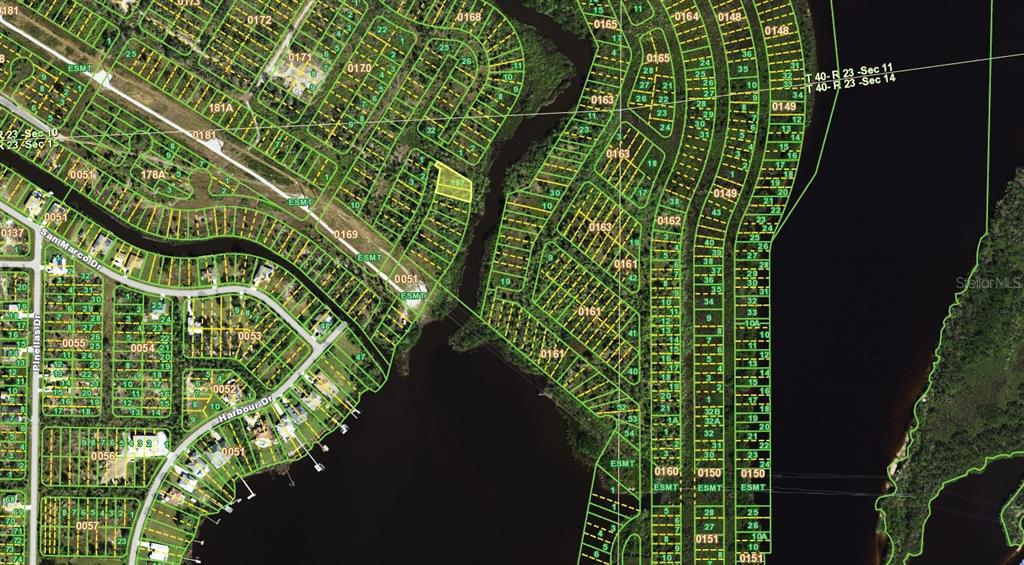 This is an aerial map showing residential lots and waterways in a suburban neighborhood — 1582 HALMSTAD DRIVE, PUNTA GORDA, FL