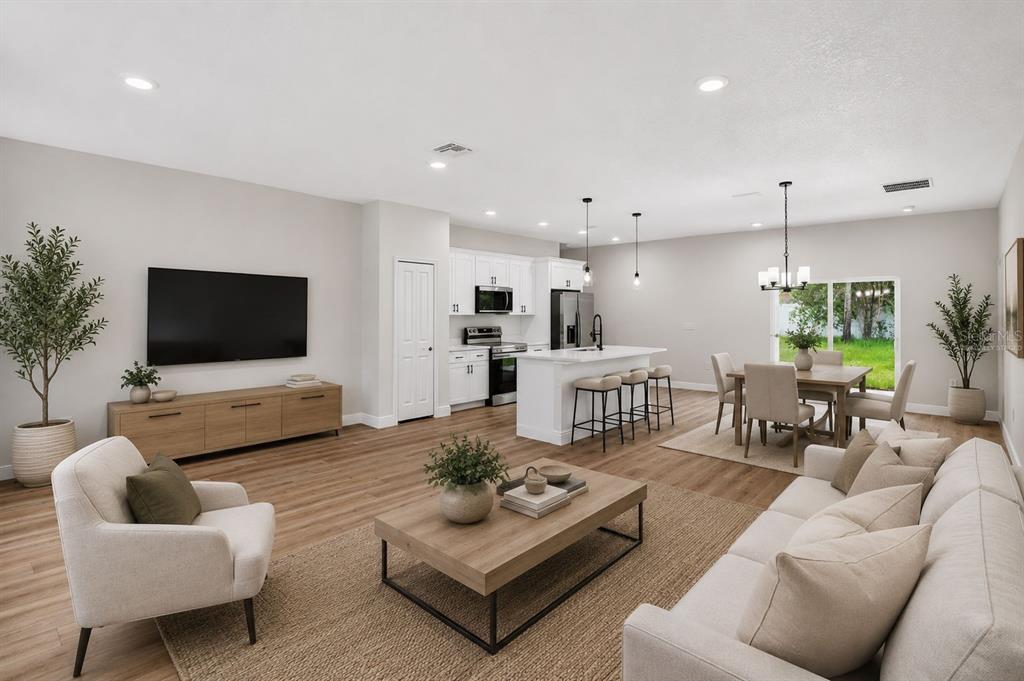 This is a rendering of an open-concept living room and kitchen with light wood flooring — 8135 N TINY LILY DRIVE, CITRUS SPRINGS, FL