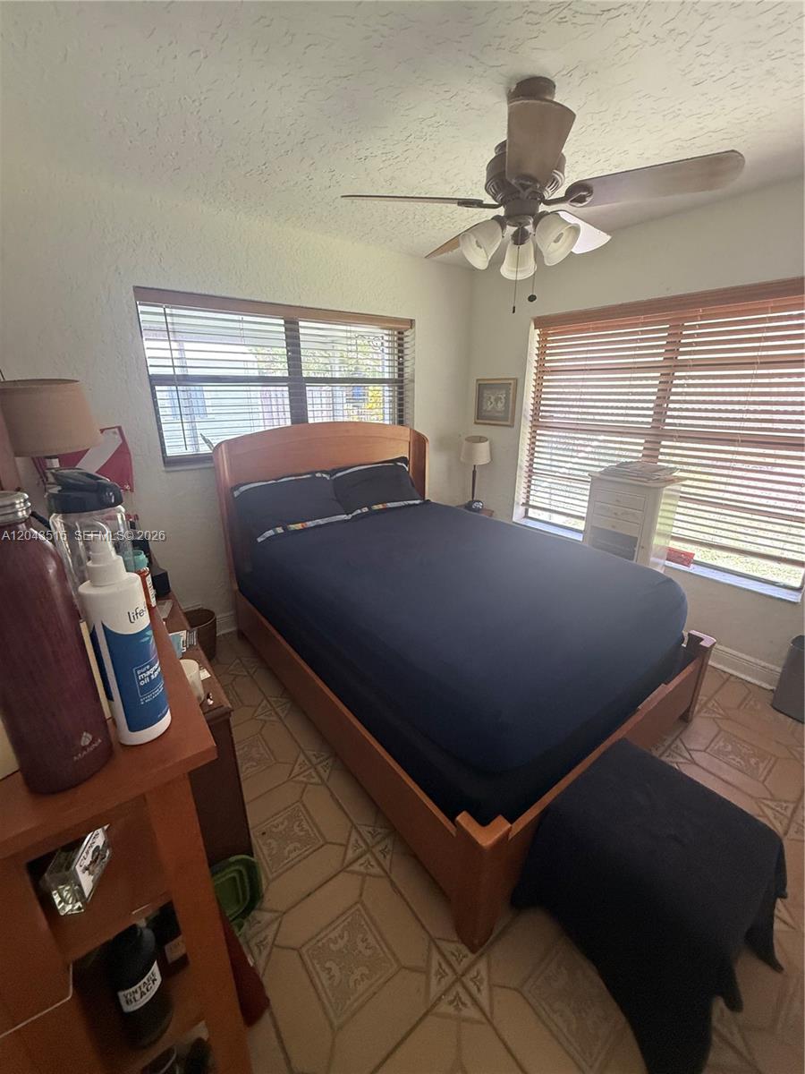 A front yard features a paved walkway, a manicured lawn, and several palm trees — 1232 SW 1st Ave, Pompano Beach FL 33060, POMPANO BEACH, FL