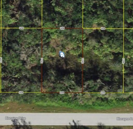 This is an aerial map view of a rectangular vacant lot located along a road — 972 BISCAYNE DRIVE, PORT CHARLOTTE, FL