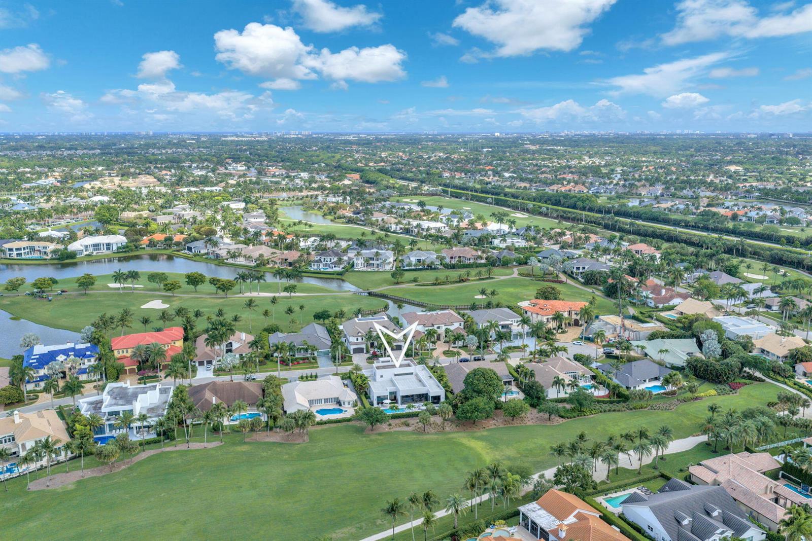 An aerial view shows a modern white house situated on a golf course in Florida — 17787 Scarsdale Way, Boca Raton FL 33496, BOCA RATON, FL
