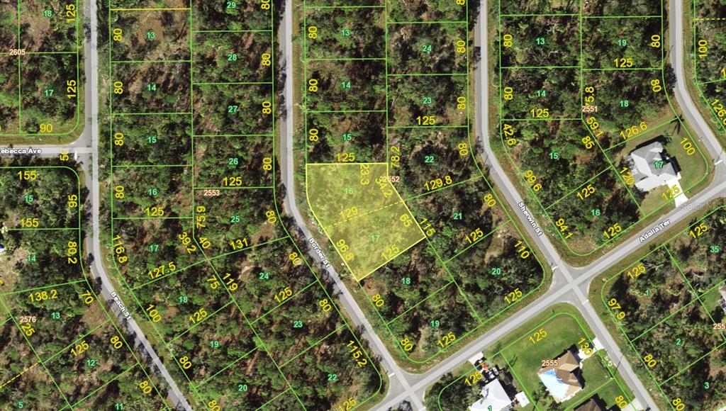 This is a map showing a highlighted vacant lot surrounded by wooded residential properties — 1130 BORDER STREET, PORT CHARLOTTE, FL