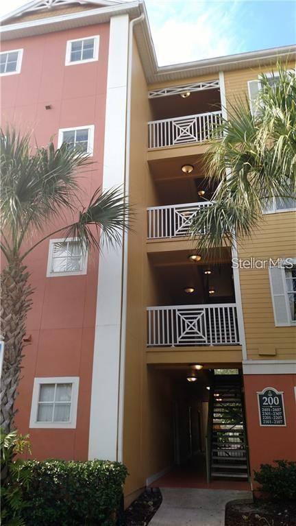 Exterior view of a multi-story apartment building with balconies and an outdoor staircase — 4207 S DALE MABRY HIGHWAY UNIT 2401, TAMPA, FL