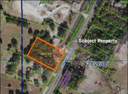 This is an aerial map showing a highlighted rectangular parcel of land along a highway — 6401 HWY 17 92 N, DAVENPORT, FL