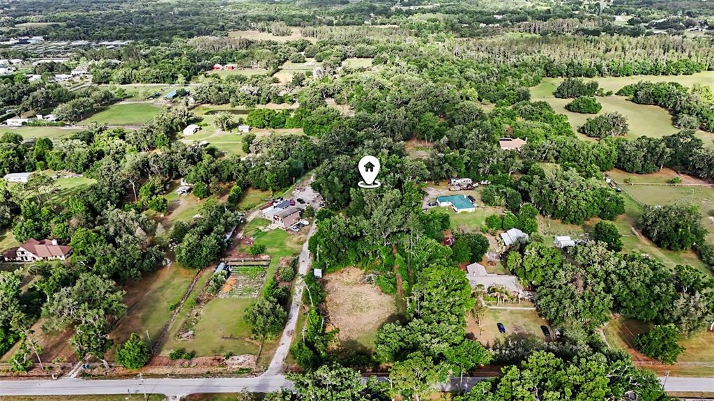 An aerial view shows a wooded residential lot with a house icon marker — 4103 STANLEY ROAD, PLANT CITY, FL