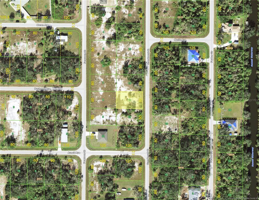 This is a satellite map showing residential lots and streets in a wooded area — 187 GRANDMONT STREET, PORT CHARLOTTE, FL