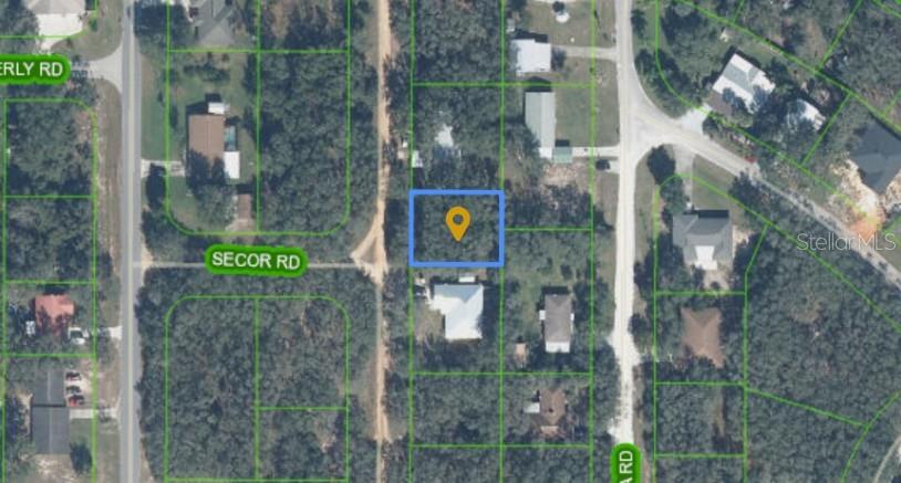 This is an aerial map view showing a highlighted vacant lot in a residential area — 1864 N FANTASY ROAD, AVON PARK, FL