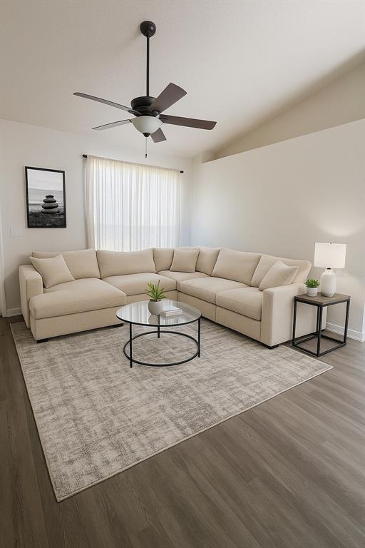 A living room features a beige sectional sofa, a glass coffee table, and a ceiling fan — 1293 COURTLAND BOULEVARD, DELTONA, FL
