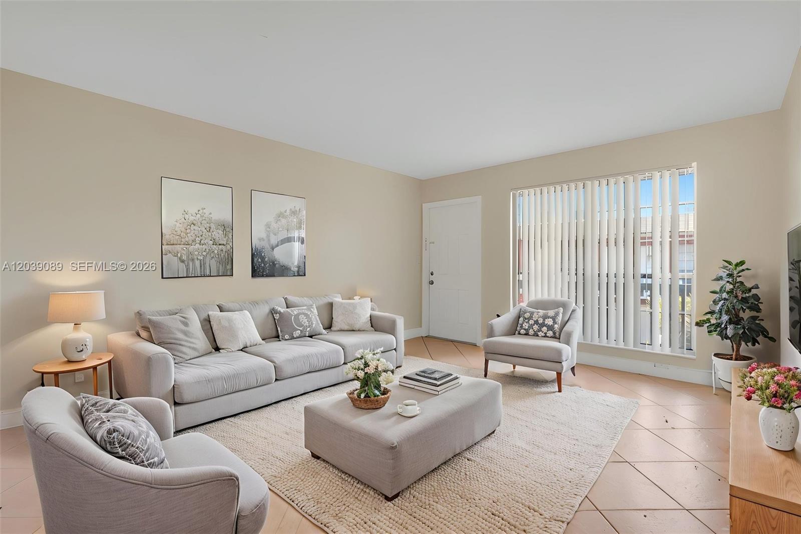 A living room features a sofa, two armchairs, an ottoman, and tile flooring — 2151 NW 64th Ave, Sunrise FL 33313, SUNRISE, FL