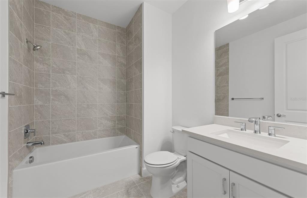 This is a floor plan for a single-story home featuring two bedrooms, a den, and garage — 14232 EAGLE BRANCH DRIVE, NOKOMIS, FL