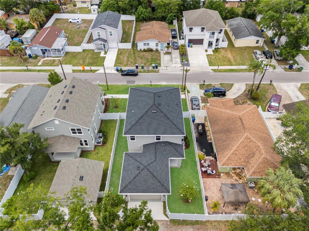 An aerial view shows several suburban houses with fenced yards and driveways — 1522 W ARCH STREET, TAMPA, FL