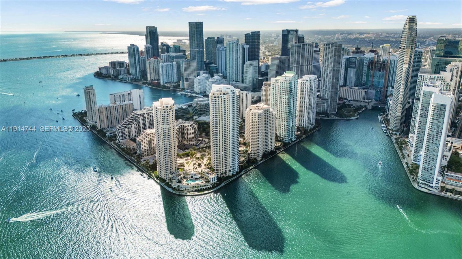 An aerial view of the Miami skyline featuring high-rise buildings along the waterfront — 900 Brickell Key Blvd # 1403, Miami FL 33131, MIAMI, FL