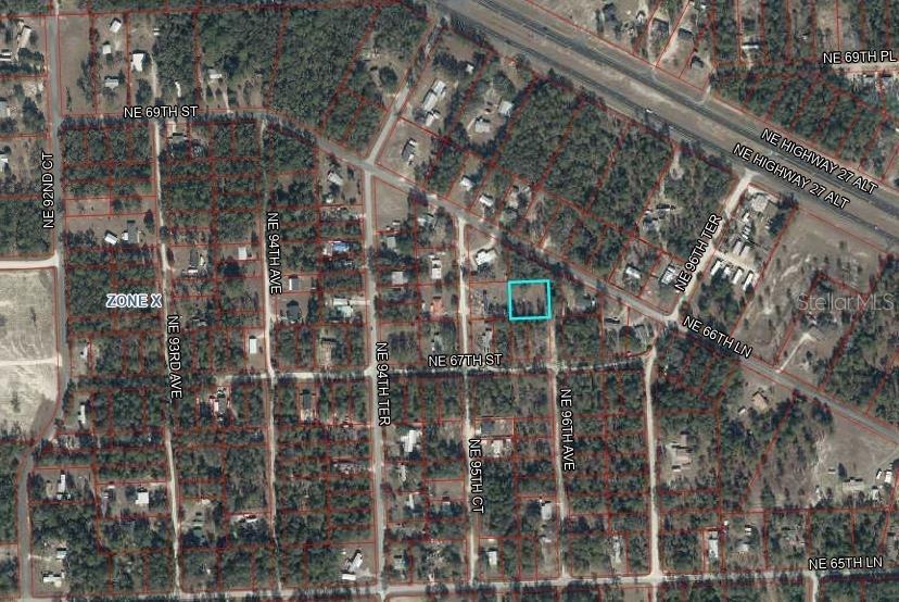 An aerial map view shows a highlighted rectangular property lot within a residential neighborhood — Lot 2&3 NE 95TH AVE, BRONSON, FL