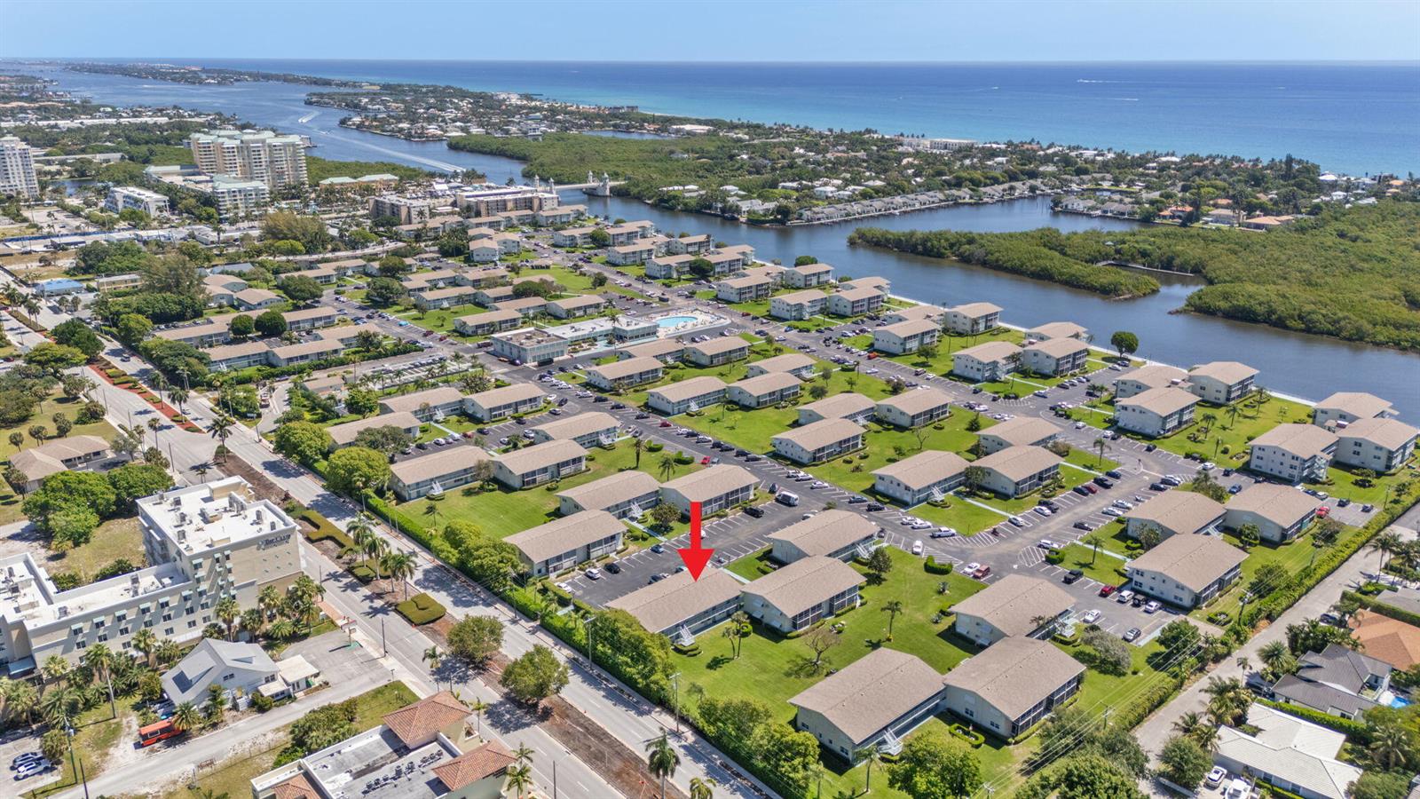An aerial view shows a multi-unit residential complex with a red arrow pointing to one building — 740 W Horizons W # 203, Boynton Beach FL 33435, BOYNTON BEACH, FL