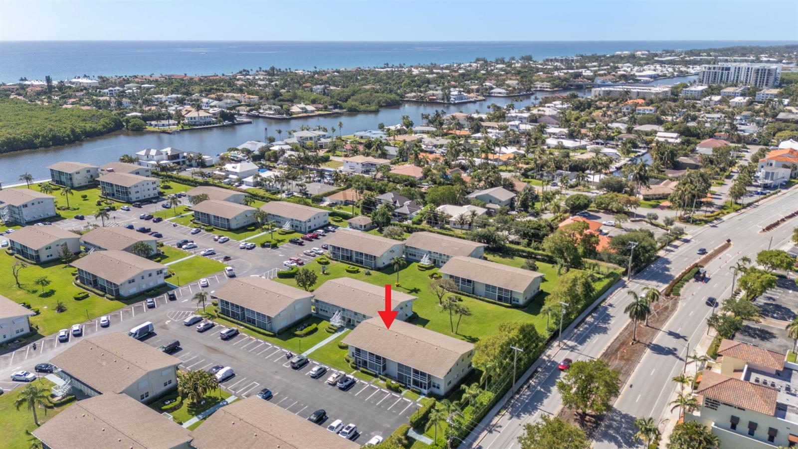 An aerial view shows a multi-story apartment complex with parking lots and surrounding residential landscaping — 740 W Horizons W # 203, Boynton Beach FL 33435, BOYNTON BEACH, FL