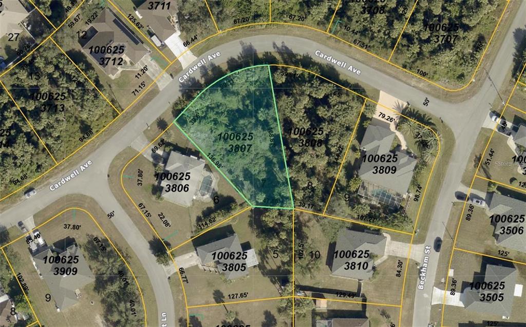 This is an aerial map showing a vacant residential lot highlighted in green — CARDWELL AVENUE, NORTH PORT, FL