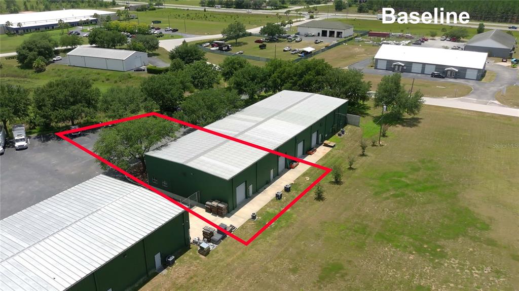 An aerial view shows a green industrial warehouse building outlined in red — 7731 SE 59TH COURT UNIT 300, OCALA, FL