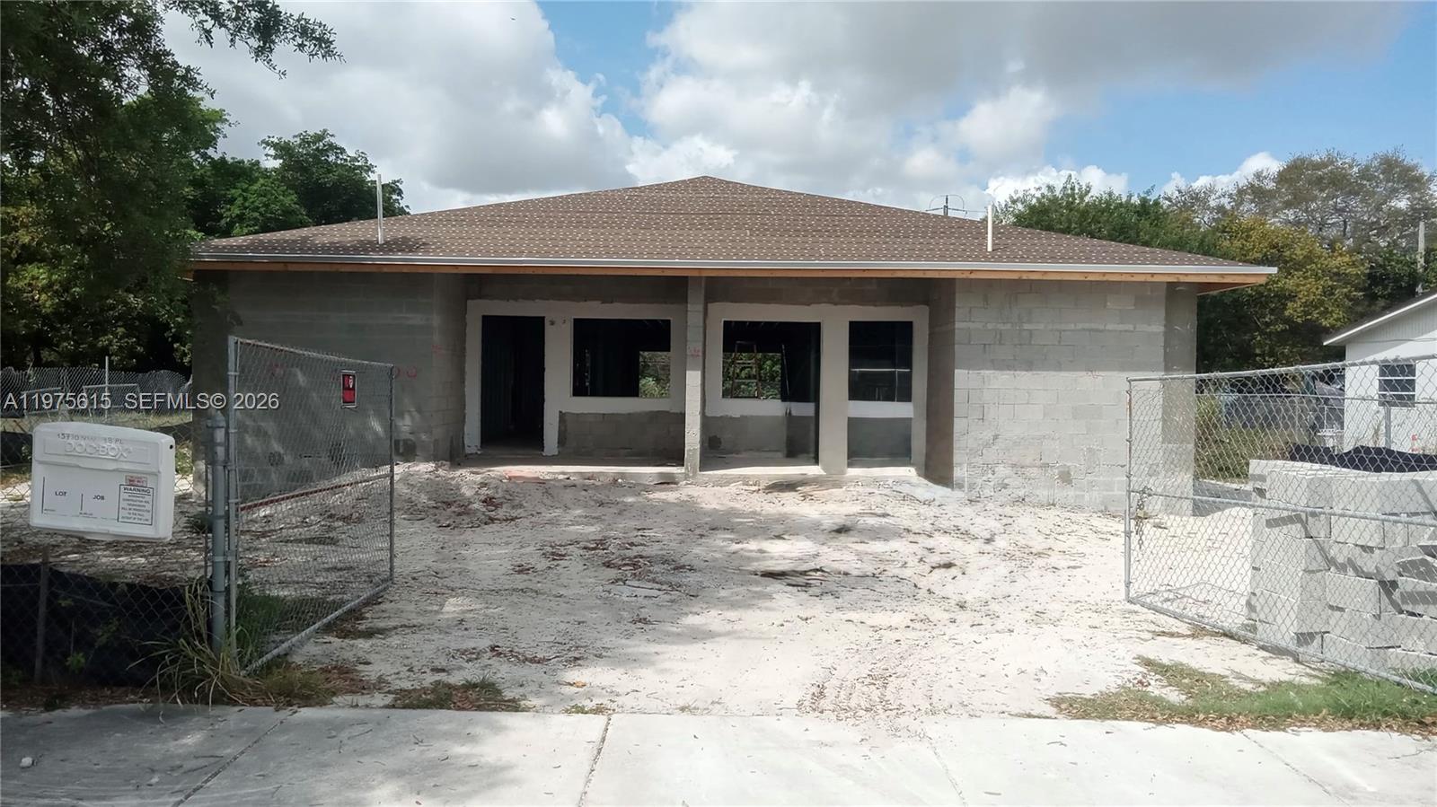 A single-story house under construction features exposed concrete block walls and a finished roof — 15730 NW 38th Pl, Miami Gardens FL 33054, MIAMI GARDENS, FL
