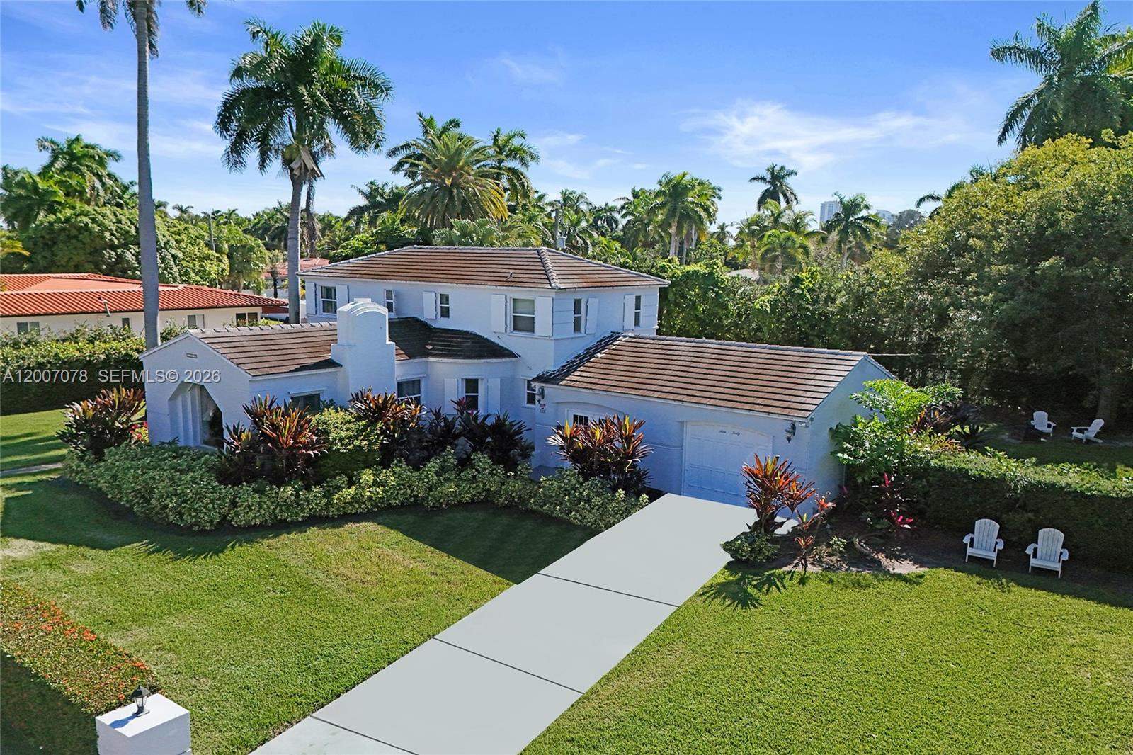 A two-story white house with a brown tile roof sits on a grassy lot — 940 Hollywood Blvd, Hollywood FL 33019, HOLLYWOOD, FL