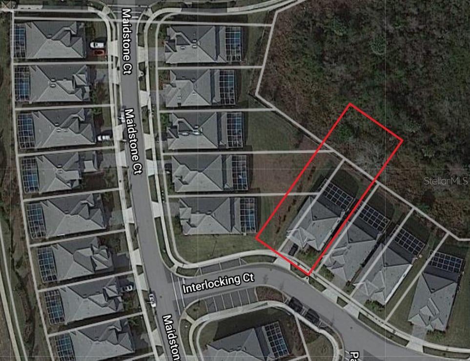 This aerial map shows a residential property highlighted in red within a suburban neighborhood — 8847 INTERLOCKING COURT, DAVENPORT, FL