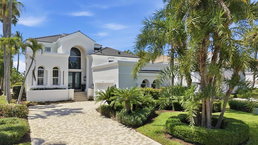 A wooden dock leads through mangrove trees toward a boat lift on a sunny day — 3606 FAIR OAKS PLACE, LONGBOAT KEY, FL