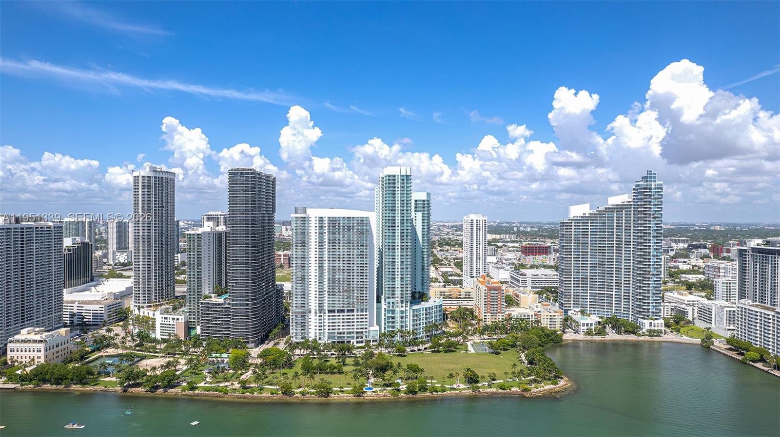 An aerial view shows a waterfront park surrounded by high-rise apartment buildings in Miami — 1900 N BAYSHORE DR, Miami FL 33132, MIAMI, FL