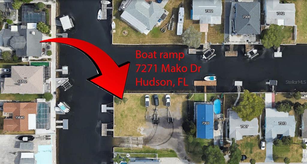 This aerial map shows a residential canal-front property featuring a private boat ramp — 8165 GULF WAY, HUDSON, FL