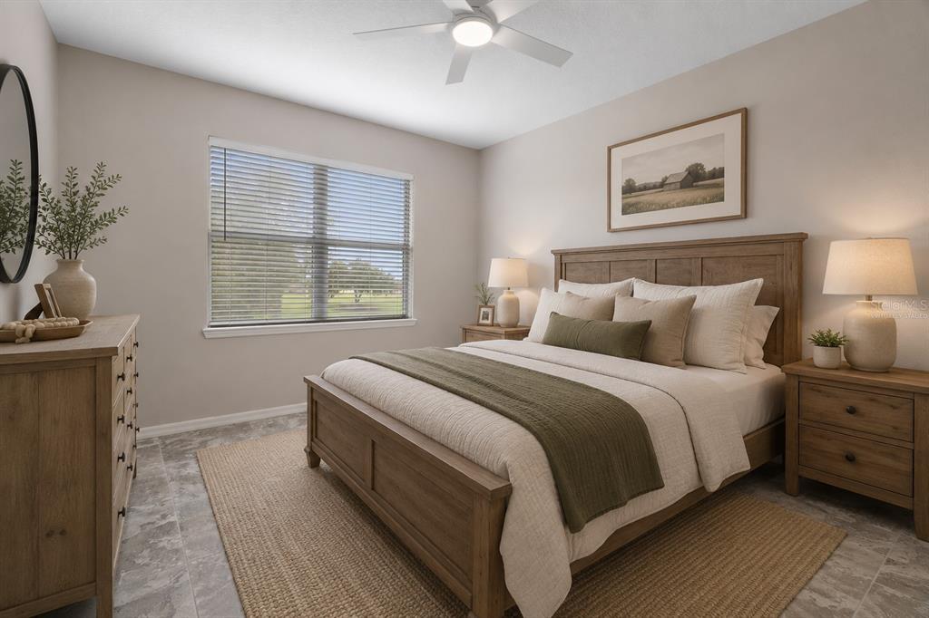 A bedroom features a wooden bed frame, a dresser, and a window with blinds — 30798 WATER LILY DRIVE, BROOKSVILLE, FL
