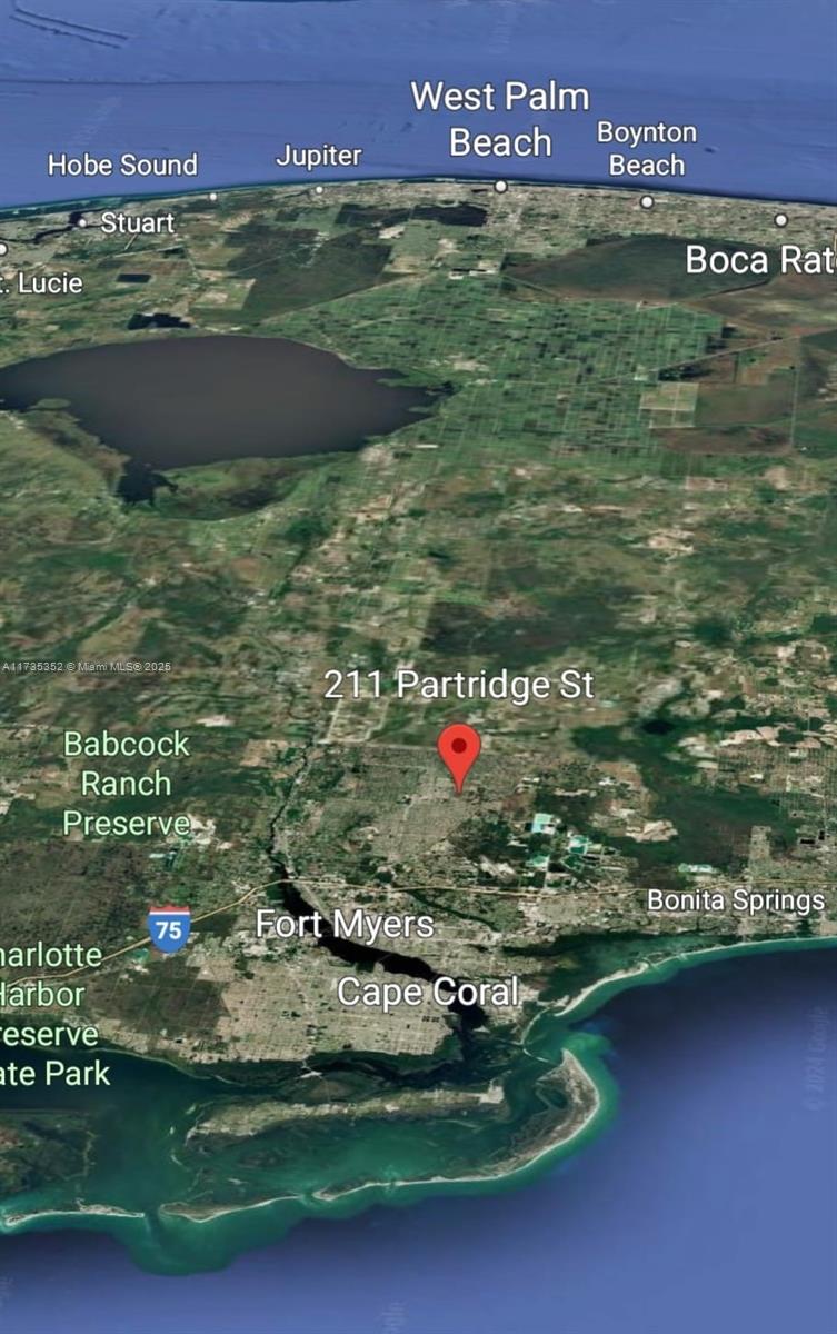 This is a satellite map view showing a red location pin in Florida — 211 Partridge, Lehigh Acres FL 33974, LEHIGH ACRES, FL