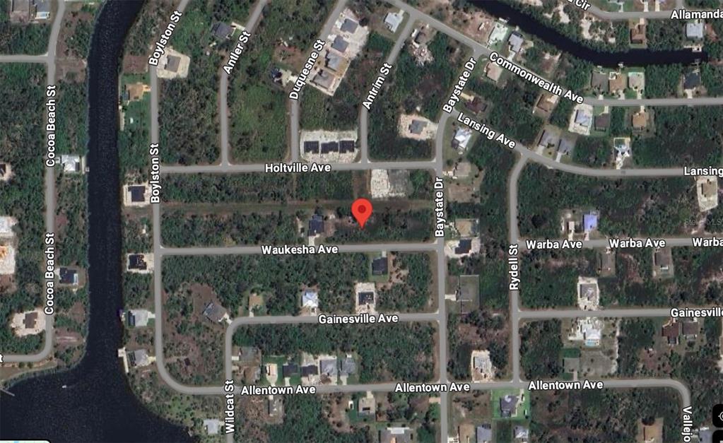 This is a satellite map view showing a residential area with streets and a red marker — 13328 WAUKESHA AVENUE, PORT CHARLOTTE, FL