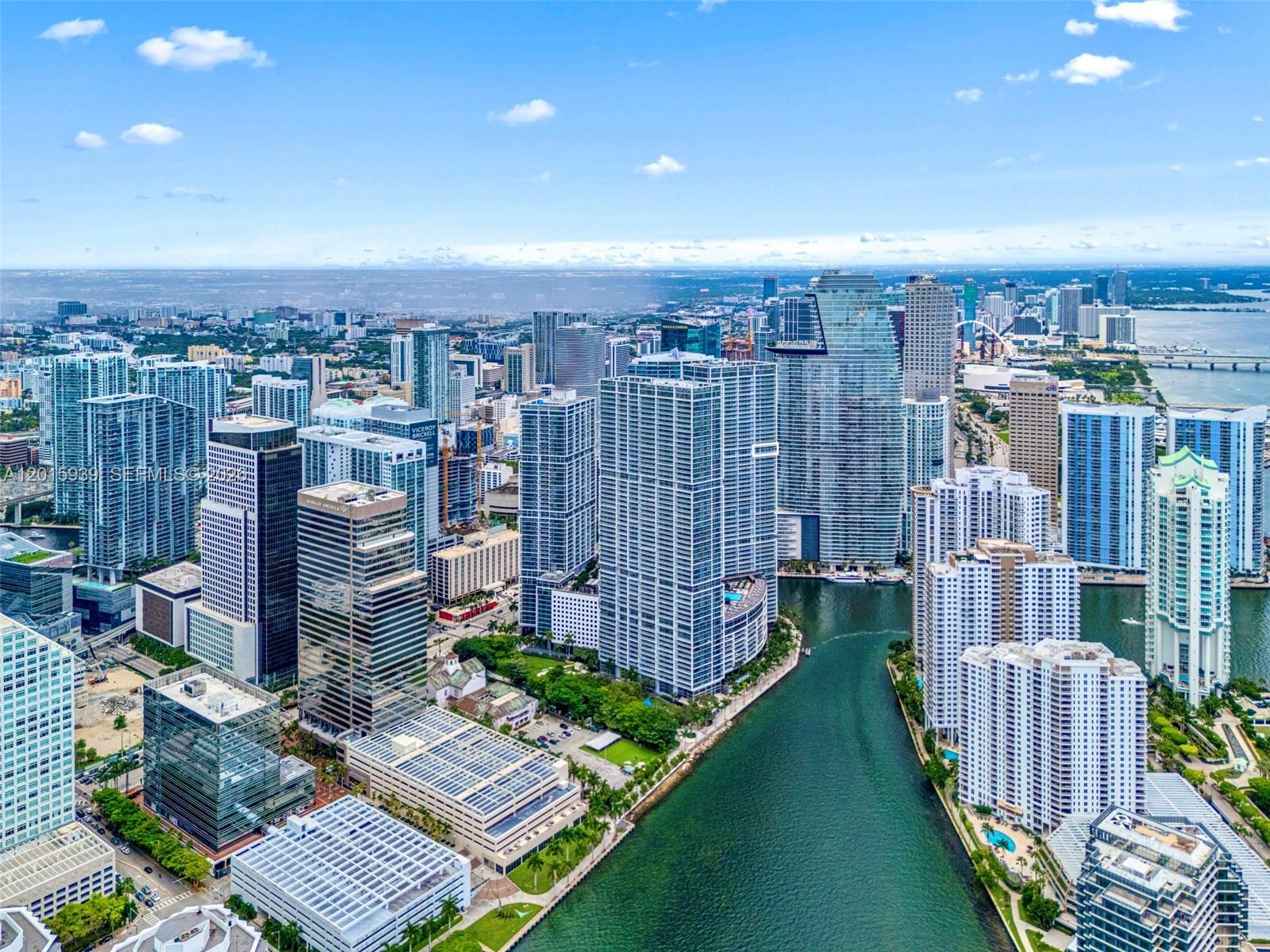 An aerial view of the Miami skyline featuring high-rise buildings along a river — 465 Brickell Ave # 4101, Miami FL 33131, MIAMI, FL