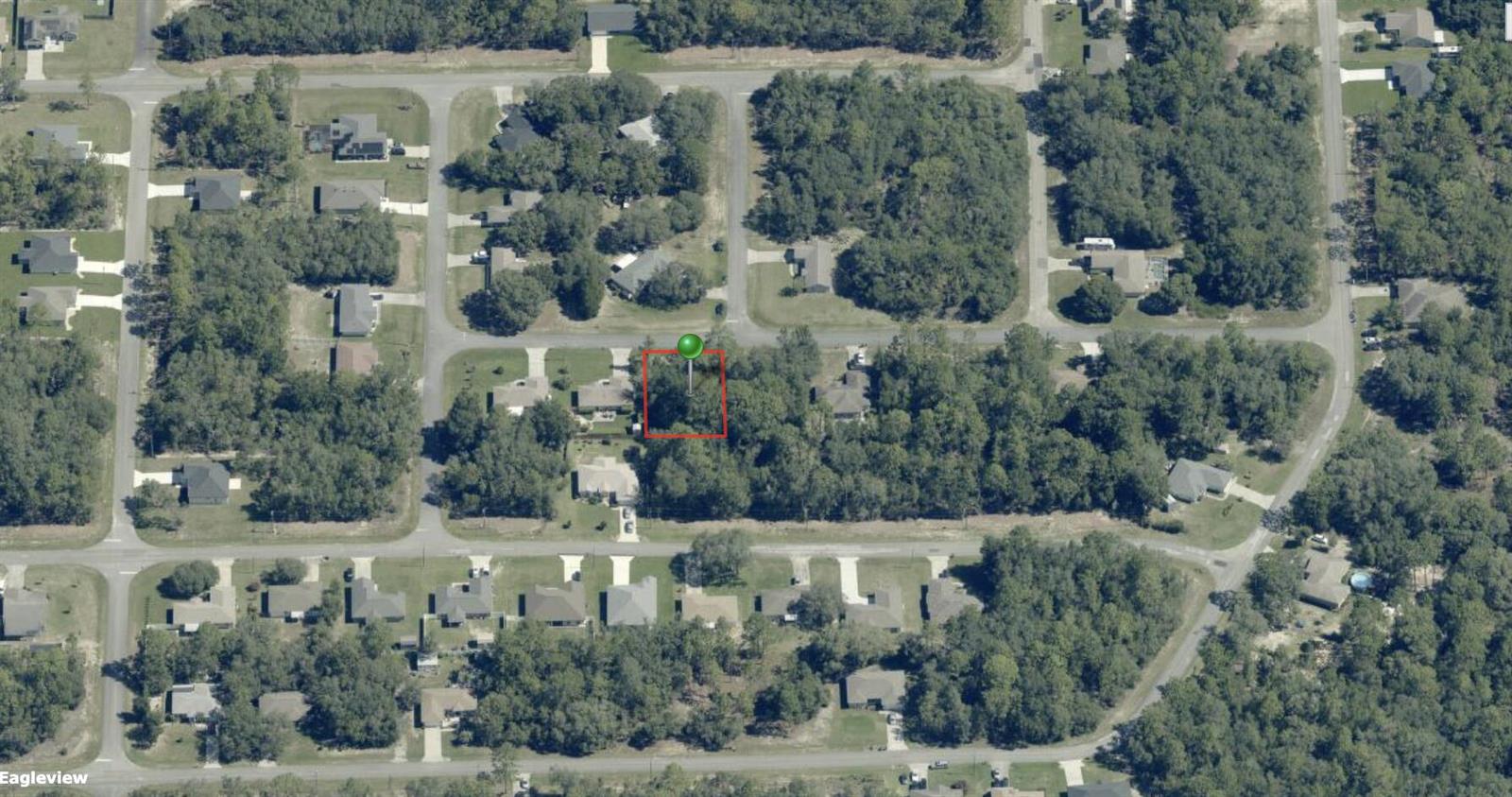 An aerial view shows a vacant, wooded residential lot outlined in red — 544 W La Casita Lane, FL 34434, FL